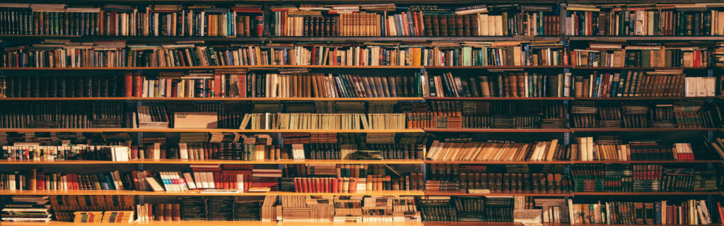 Cozy, dark library with shelves of old books